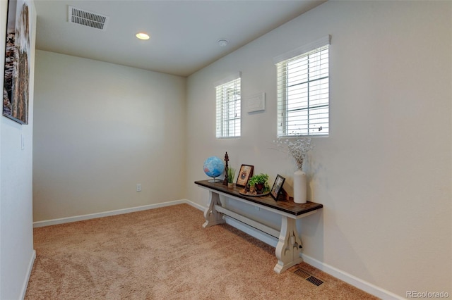 interior space featuring carpet, baseboards, and recessed lighting