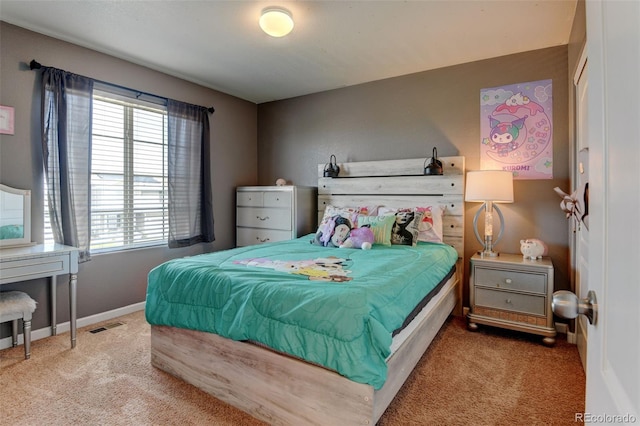 carpeted bedroom featuring baseboards