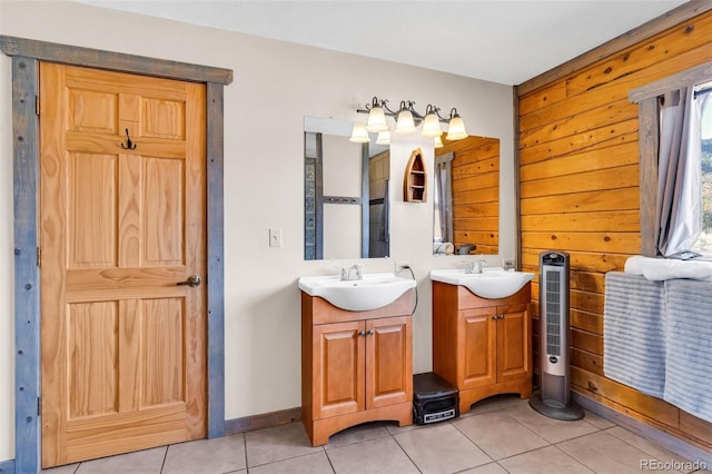 bathroom featuring tile patterned floors, wooden walls, and vanity