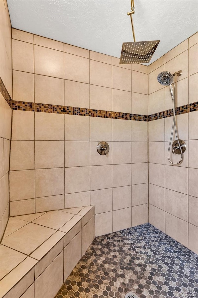 bathroom with a tile shower