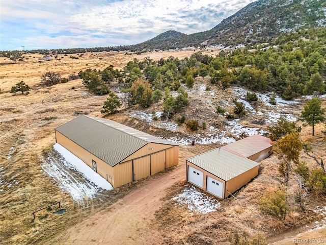 birds eye view of property with a mountain view