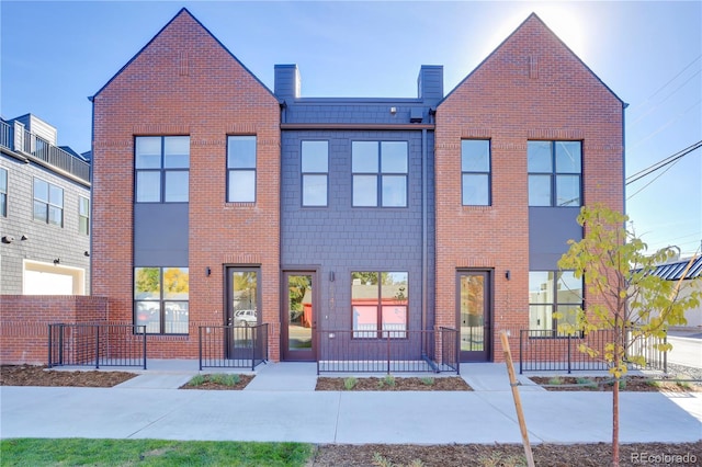 view of property featuring brick siding