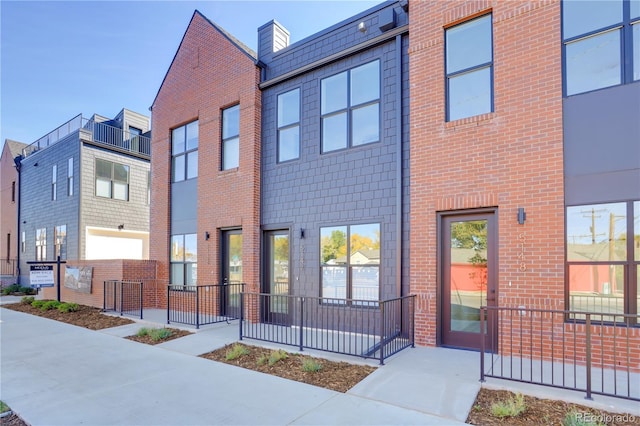 view of front of property featuring brick siding