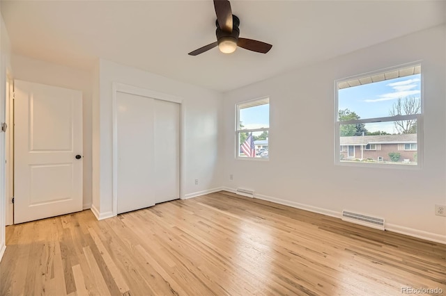 4244 W Monmouth Ave, Littleton, CO 80123 - unfurnished bedroom with light wood finished floors, a closet, and ceiling fan