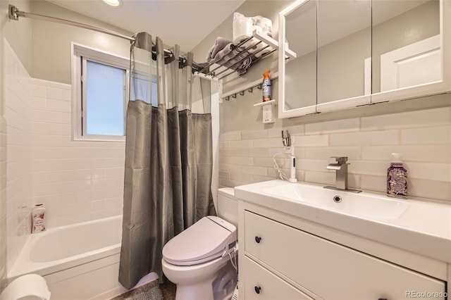4244 W Monmouth Ave, Littleton, CO 80123 - full bathroom featuring vanity, shower / bath combo, and tile walls