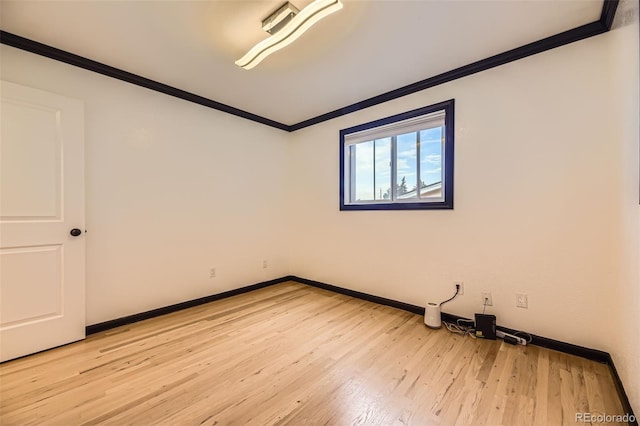 4244 W Monmouth Ave, Littleton, CO 80123 - unfurnished room featuring ornamental molding and light wood-style floors