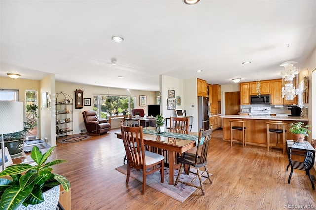 1601 Columbine Pl, Colorado Springs, CO 80907 - dining space featuring light wood finished floors and recessed lighting