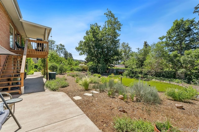 1601 Columbine Pl, Colorado Springs, CO 80907 - view of yard featuring stairway, a patio, and a deck