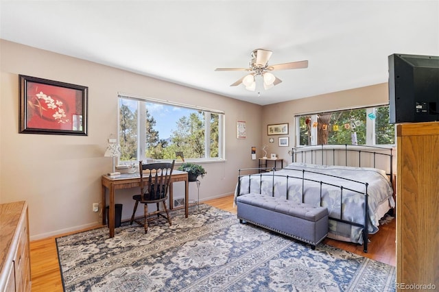 1601 Columbine Pl, Colorado Springs, CO 80907 - bedroom featuring multiple windows, wood finished floors, and an office area