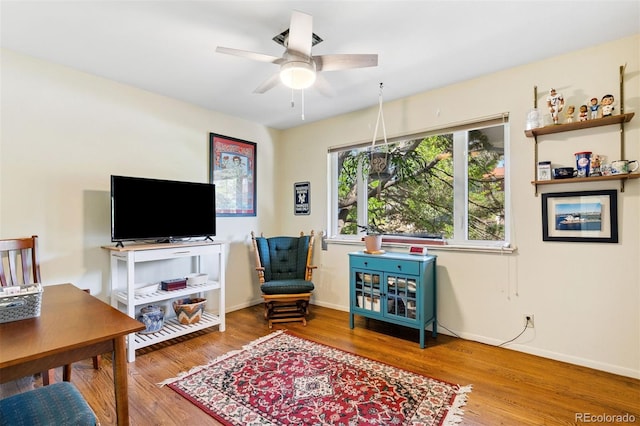 1601 Columbine Pl, Colorado Springs, CO 80907 - living area with wood finished floors and ceiling fan
