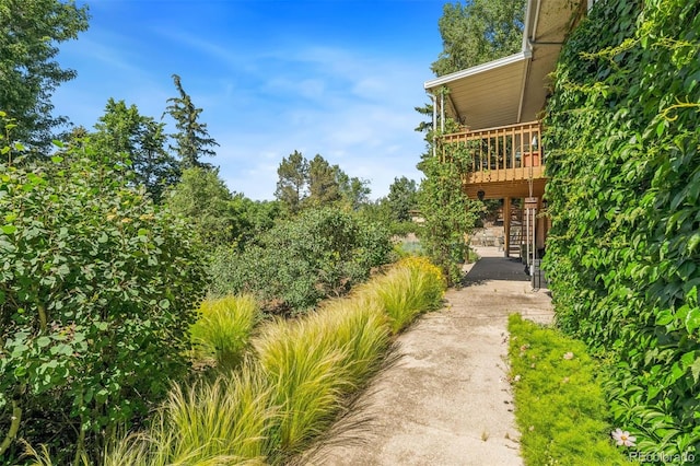 1601 Columbine Pl, Colorado Springs, CO 80907 - view of yard featuring stairway, driveway, and a deck