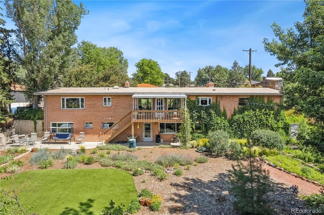 1601 Columbine Pl, Colorado Springs, CO 80907 - back of house featuring stairway, a patio, a deck, and a chimney