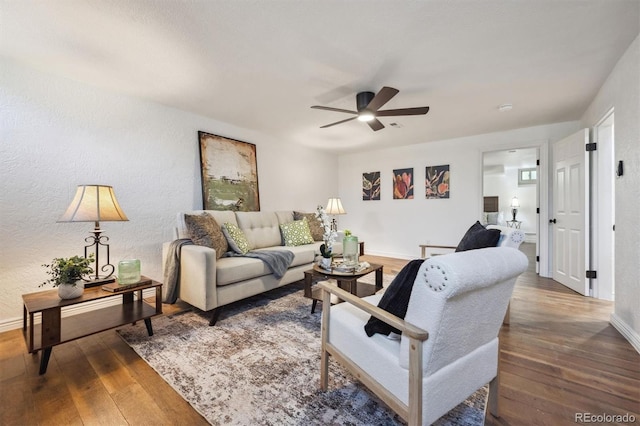 4434 Grove St, Denver, CO 80211 - living room with wood-type flooring, a ceiling fan, a textured wall, and baseboards