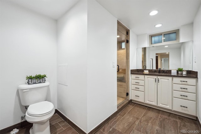 4434 Grove St, Denver, CO 80211 - full bath featuring toilet, a shower stall, recessed lighting, vanity, and baseboards