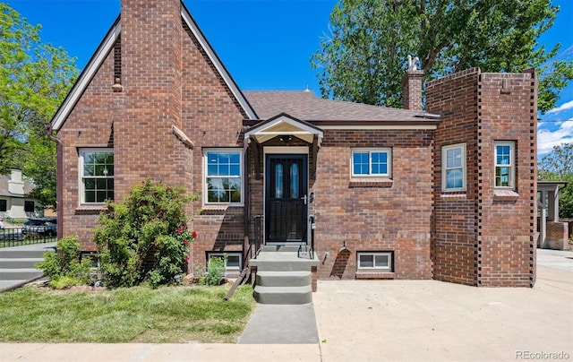 4434 Grove St, Denver, CO 80211 - view of front of house featuring a chimney and brick siding