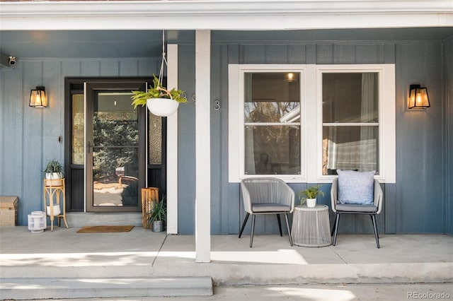 view of exterior entry with covered porch