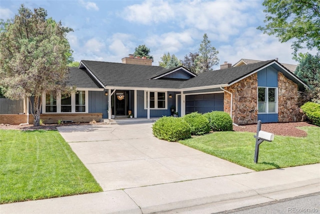 mid-century inspired home featuring a chimney, an attached garage, board and batten siding, driveway, and a front lawn