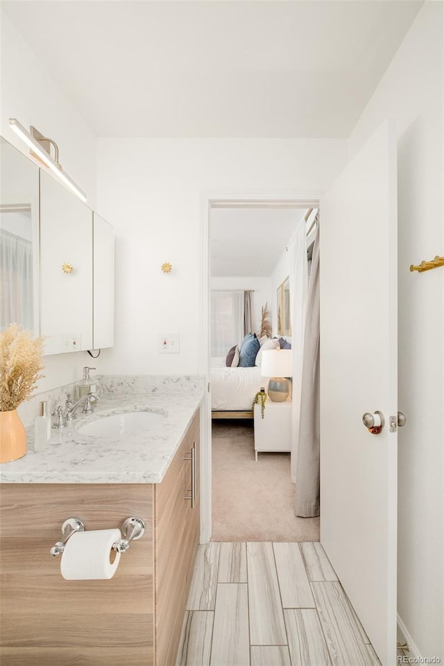 bathroom featuring vanity and ensuite bath