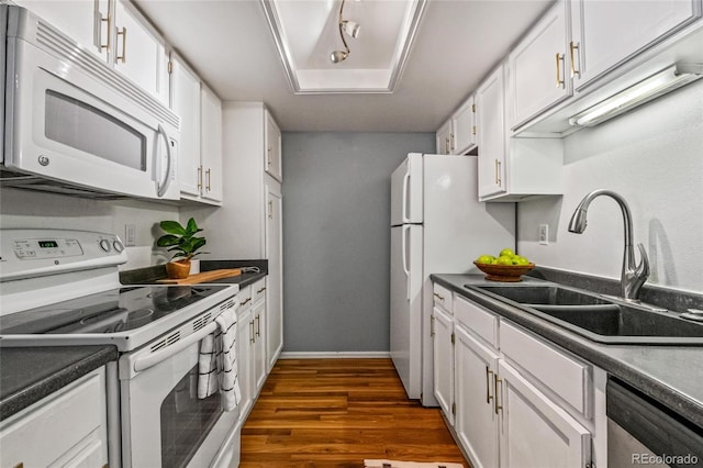 8600 E Alameda Ave Unit 13-108, Denver, CO 80247 - kitchen featuring white appliances, dark wood-type flooring, white cabinets, and dark countertops