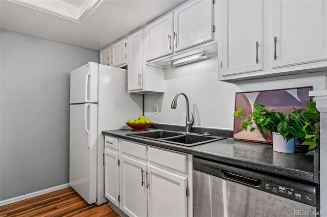 8600 E Alameda Ave Unit 13-108, Denver, CO 80247 - kitchen featuring dishwasher, dark countertops, white cabinets, dark wood finished floors, and freestanding refrigerator