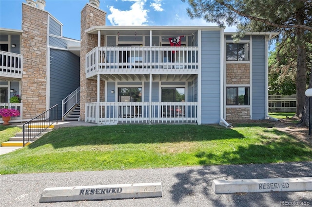 8600 E Alameda Ave Unit 13-108, Denver, CO 80247 - view of building exterior with stairs and uncovered parking