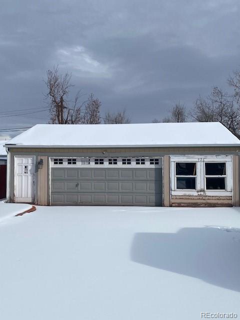 view of snow covered garage