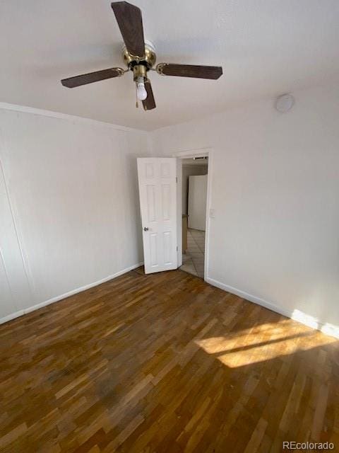 spare room featuring dark wood-type flooring