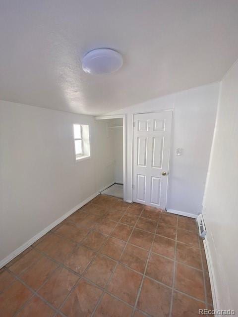 unfurnished bedroom featuring a closet