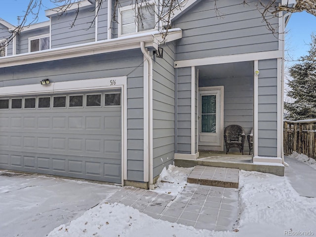 view of snow covered garage