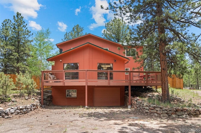 561 Quartz Cir, Bailey, CO 80421 - view of front of home with a garage, driveway, and a wooden deck