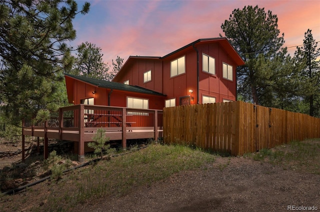 561 Quartz Cir, Bailey, CO 80421 - rear view of property with board and batten siding and a wooden deck