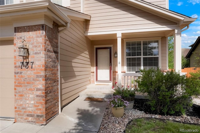 737 Novick Ct, Castle Rock, CO 80109 - view of exterior entry featuring covered porch and a garage