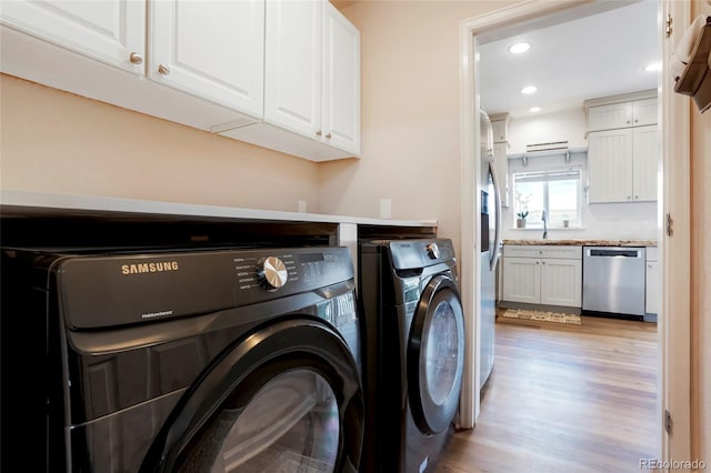 737 Novick Ct, Castle Rock, CO 80109 - laundry area featuring washing machine and clothes dryer, cabinet space, light wood-type flooring, and recessed lighting