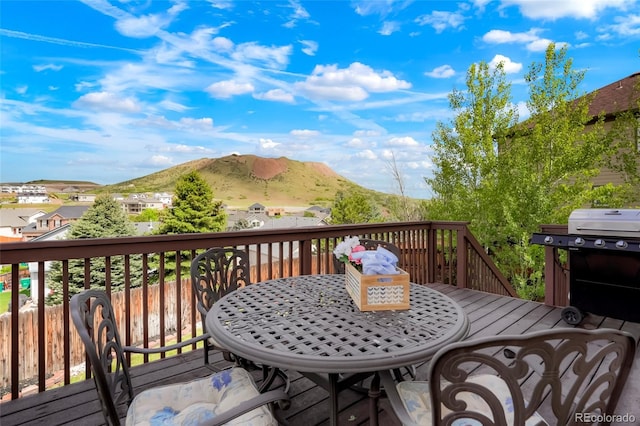 737 Novick Ct, Castle Rock, CO 80109 - wooden terrace featuring a mountain view, outdoor dining space, and grilling area