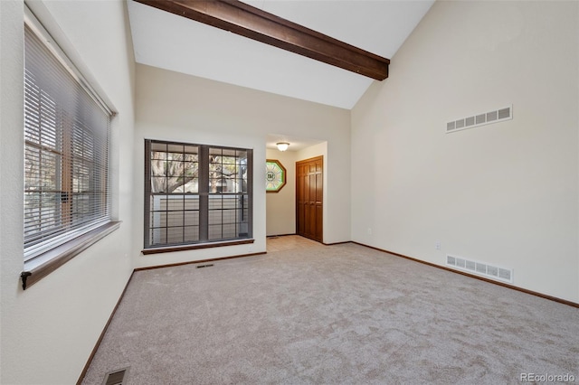 carpeted spare room featuring high vaulted ceiling and beamed ceiling