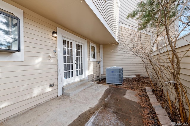 view of patio / terrace featuring cooling unit and french doors