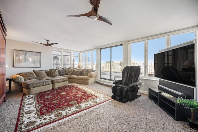 living room with ceiling fan and carpet