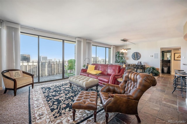 living room featuring floor to ceiling windows