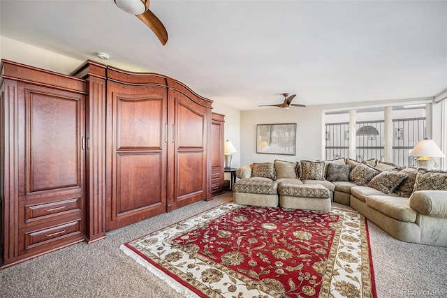 living room with light carpet and ceiling fan