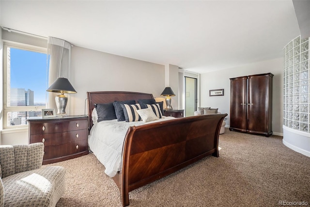 bedroom featuring light carpet