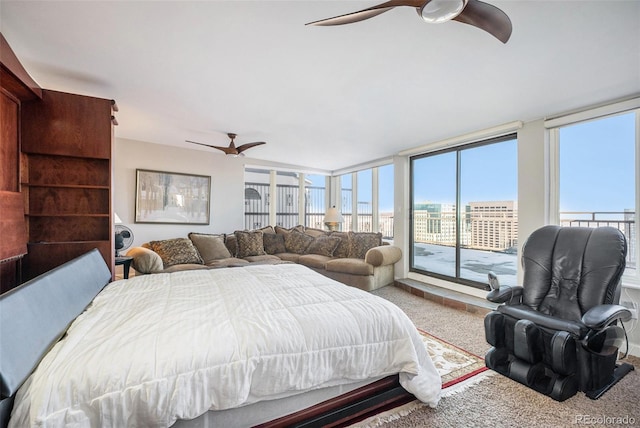 carpeted bedroom featuring ceiling fan and access to outside