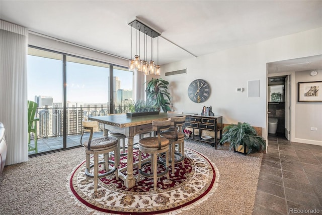 1020 15th St Unit 42C, Denver, CO 80202 - dining space with a view of city and baseboards