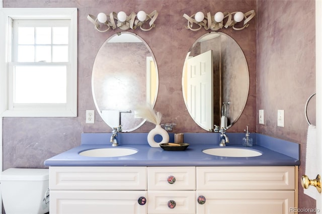 bathroom with vanity and toilet