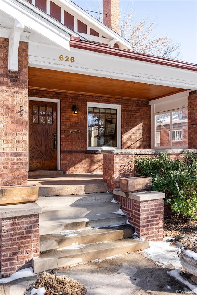 property entrance with covered porch