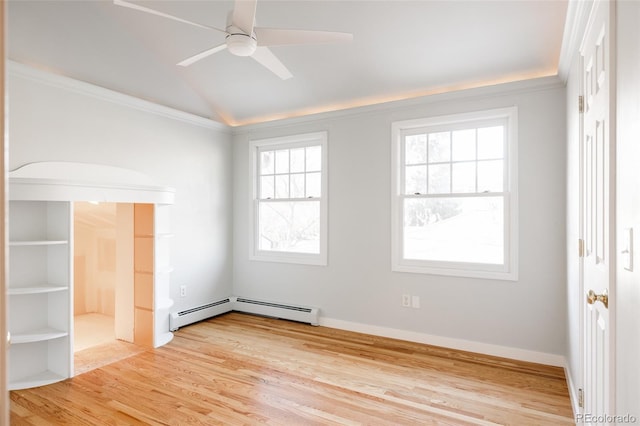 unfurnished room with lofted ceiling, ceiling fan, ornamental molding, light hardwood / wood-style floors, and a baseboard radiator