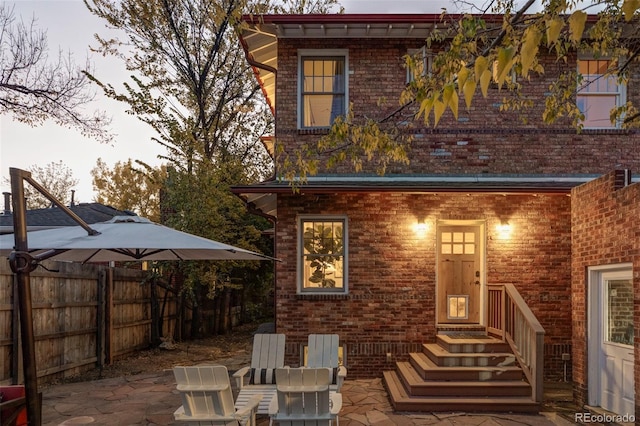 rear view of property featuring a patio area