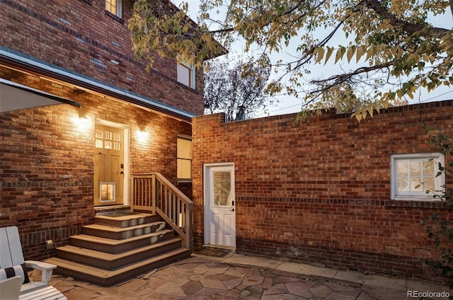 doorway to property featuring a patio area