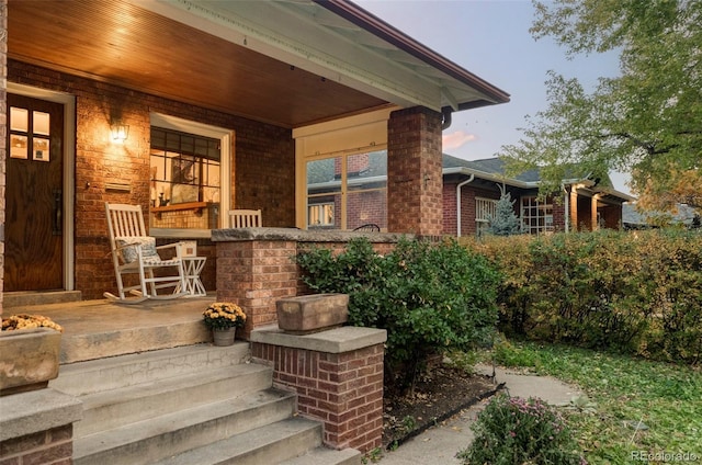 exterior entry at dusk with a porch