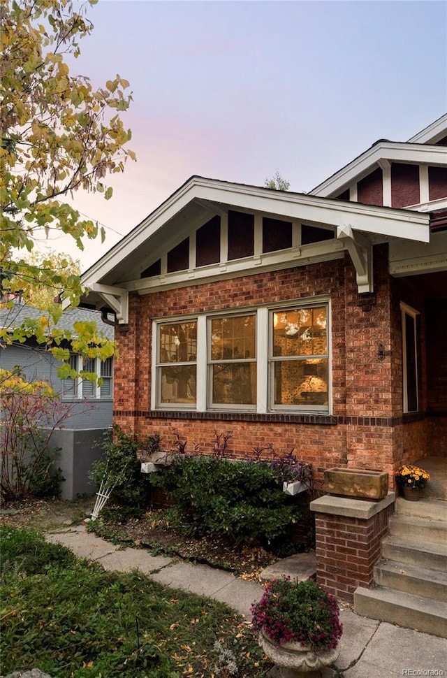 view of property exterior at dusk