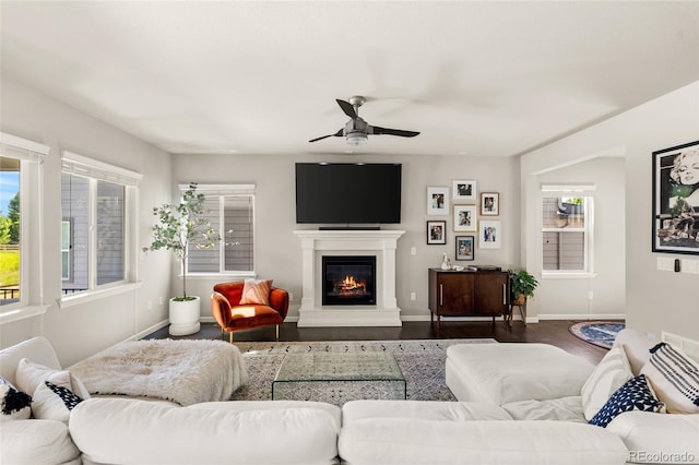 4778 Ravencrest Pl, Castle Rock, CO 80108 - living room with ceiling fan, a glass covered fireplace, and dark wood finished floors